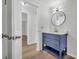Modern bathroom with stylish blue vanity, marble countertop, gold hardware, and updated fixtures at 6235 Akins Way, Cumming, GA 30041