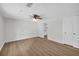 Clean bedroom featuring wood-look flooring, ceiling fan, and neutral wall color at 6235 Akins Way, Cumming, GA 30041