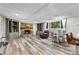 Finished basement featuring tile flooring, a fireplace, bar seating, and ample room for entertaining at 630 Buttercup Trce, Johns Creek, GA 30022