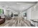 Finished basement featuring tile flooring, a kitchenette, seating area, and ample space for entertaining at 630 Buttercup Trce, Johns Creek, GA 30022