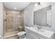 Updated bathroom with a glass-enclosed shower and a modern vanity with good storage space at 630 Buttercup Trce, Johns Creek, GA 30022