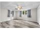 This bedroom offers new vinyl floors, fresh paint, and a ceiling fan at 630 Buttercup Trce, Johns Creek, GA 30022