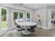 Cozy breakfast nook with a round table, surrounded by natural light and access to the backyard at 630 Buttercup Trce, Johns Creek, GA 30022