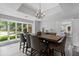 Formal dining area with large windows, hardwood floors, and modern decor at 630 Buttercup Trce, Johns Creek, GA 30022