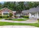 Inviting front entrance with beautiful landscaping, walkway, and well-maintained yard at 630 Buttercup Trce, Johns Creek, GA 30022