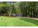 Charming brick home with lush landscaping, a circular driveway and a covered front porch at 630 Buttercup Trce, Johns Creek, GA 30022
