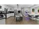 Spacious kitchen with white cabinets, stainless steel appliances, and a center island with seating at 630 Buttercup Trce, Johns Creek, GA 30022