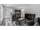 Cozy living room with hardwood floors, modern furniture, and a fireplace for a relaxing atmosphere at 630 Buttercup Trce, Johns Creek, GA 30022