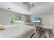 Bright main bedroom features stylish flooring, vaulted ceiling, and many windows to bring the outdoors in at 630 Buttercup Trce, Johns Creek, GA 30022