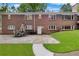 Brick home with a patio and an expansive backyard, offering ample outdoor living space at 630 Buttercup Trce, Johns Creek, GA 30022