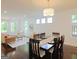 Open-concept dining and living area with hardwood floors and lots of natural light at 1454 Rome Nw Dr, Atlanta, GA 30314