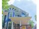 Blue two-story home featuring a decorative sunburst design and welcoming front porch at 1454 Rome Nw Dr, Atlanta, GA 30314