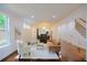 Spacious open-concept with hardwood flooring and natural light, connecting living, dining, and kitchen areas at 1454 Rome Nw Dr, Atlanta, GA 30314