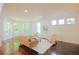 Bright living room featuring a sitting area with hardwood floors and large bay windows at 1454 Rome Nw Dr, Atlanta, GA 30314