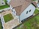 Birds eye view of a two-story house backyard featuring a stone patio, grass area, and fence at 2111 Nelms Pointe Lndg, Lawrenceville, GA 30043