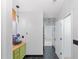 A bright bathroom with hexagonal floor tile leads to adjoining rooms at 2111 Nelms Pointe Lndg, Lawrenceville, GA 30043