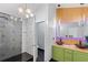 A modern bathroom featuring dual sinks, geometric shower tile, and unique fixtures at 2111 Nelms Pointe Lndg, Lawrenceville, GA 30043