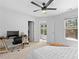 A spacious bedroom with great light, ceiling fan, and room for a study area at 2111 Nelms Pointe Lndg, Lawrenceville, GA 30043