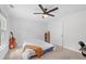 Bedroom showcasing its ceiling fan and a large window that provides natural light at 2111 Nelms Pointe Lndg, Lawrenceville, GA 30043