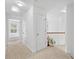 A bright hallway leads to a bedroom; note the neutral color palette at 2111 Nelms Pointe Lndg, Lawrenceville, GA 30043