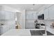 Well-appointed kitchen featuring stainless steel appliances, light gray cabinetry, and a bright quartz countertop at 2111 Nelms Pointe Lndg, Lawrenceville, GA 30043