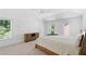 Carpeted main bedroom showcasing lots of bright, natural light from multiple windows at 2111 Nelms Pointe Lndg, Lawrenceville, GA 30043
