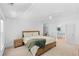 A bright main bedroom with a ceiling fan and en-suite bathroom access at 2111 Nelms Pointe Lndg, Lawrenceville, GA 30043