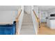 A bright, carpeted staircase connects the different levels of this lovely home at 2111 Nelms Pointe Lndg, Lawrenceville, GA 30043