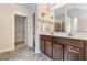 Bathroom with double vanity, soaking tub, separate shower, and tile flooring at 2149 Apple Orchard Way, Austell, GA 30168