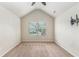 A bright bedroom with a large window, ceiling fan, and TV mount at 2149 Apple Orchard Way, Austell, GA 30168