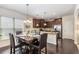 Elegant dining room with a hardwood floor, stylish table setting, and modern lighting at 2149 Apple Orchard Way, Austell, GA 30168