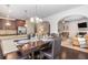 Inviting dining area with a hardwood floor, modern table setting, and easy access to the kitchen at 2149 Apple Orchard Way, Austell, GA 30168