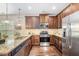 Well-equipped kitchen featuring stainless steel appliances, granite counters, and ample cabinet space at 2149 Apple Orchard Way, Austell, GA 30168