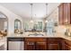 Stylish kitchen with granite countertops, stainless steel appliances, and a view to the dining area at 2149 Apple Orchard Way, Austell, GA 30168