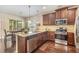 Well-equipped kitchen with granite countertops, stainless steel appliances, and custom cabinetry at 2149 Apple Orchard Way, Austell, GA 30168