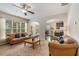 Bright living room with large windows, hardwood floors, and open access to the kitchen at 2149 Apple Orchard Way, Austell, GA 30168