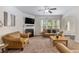 Inviting living room features a cozy fireplace, plush seating, and bright natural light at 2149 Apple Orchard Way, Austell, GA 30168