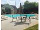 Community pool area with tables and chairs at 2149 Apple Orchard Way, Austell, GA 30168