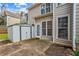 Backyard showcasing a patio with the house, shed, and outdoor space at 2325 Walnut Grove Way, Suwanee, GA 30024