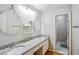 Bathroom with dual sinks, granite countertop, and a separate shower room, great for daily routines at 2325 Walnut Grove Way, Suwanee, GA 30024
