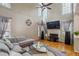 Bright living room boasts tall ceilings, large windows, hardwood floors, and neutral decor at 2325 Walnut Grove Way, Suwanee, GA 30024