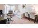 Well-lit bedroom space designed for work or study with a twin bed, desk and chair at 2490 Tack Hill Ct, Dacula, GA 30019