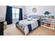 Cozy bedroom featuring blue and white decor, and an adjacent bookcase for added style at 2490 Tack Hill Ct, Dacula, GA 30019