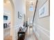 Elegant foyer with soaring ceilings, hardwood floors, decorative molding and bench seating for guests at 2490 Tack Hill Ct, Dacula, GA 30019