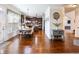 Eat-in kitchen flows into living space with beautiful dark wood flooring and light, neutral paint colors at 2490 Tack Hill Ct, Dacula, GA 30019