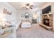 Inviting living room featuring a fireplace, plush carpeting, modern furniture, and lots of natural light at 2490 Tack Hill Ct, Dacula, GA 30019