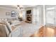 Bright living room with a stone fireplace, plush carpeting, neutral decor, and lots of natural light at 2490 Tack Hill Ct, Dacula, GA 30019