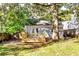 Charming backyard featuring a deck and lush greenery, providing a tranquil and private outdoor escape at 2876 Randall St, East Point, GA 30344