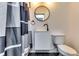 Modern bathroom with a stylish vanity, round mirror, and a contemporary shower curtain, offering a clean and updated design at 2876 Randall St, East Point, GA 30344