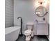 Stylish bathroom with modern fixtures, including a sleek sink and soaking tub, creating a spa-like experience at 2876 Randall St, East Point, GA 30344